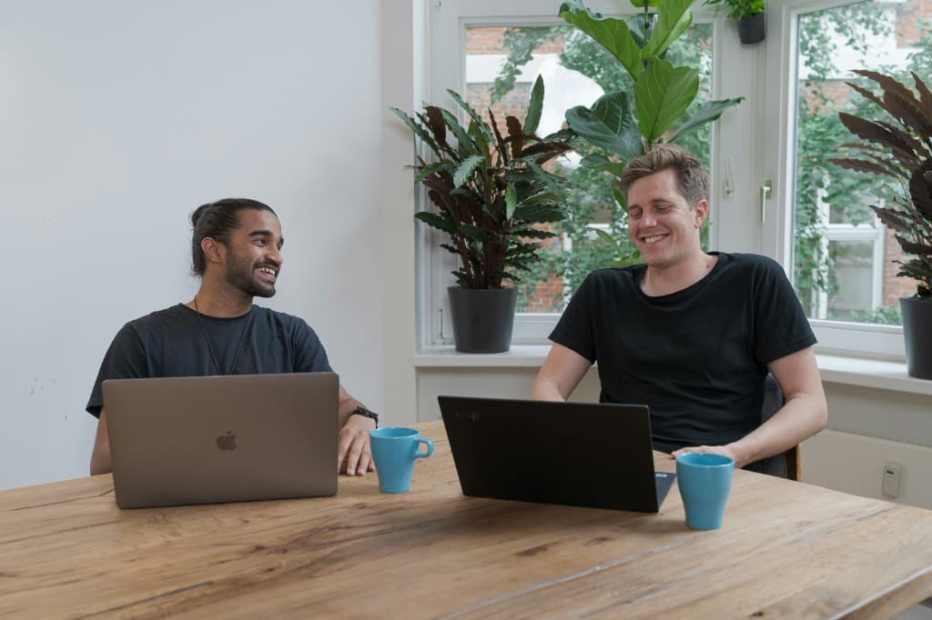 Two people working together on member work